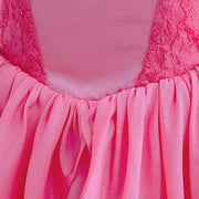 Close-up of layered pink lace dress for girls, showcasing elegant fabric and flowing design for summer events.